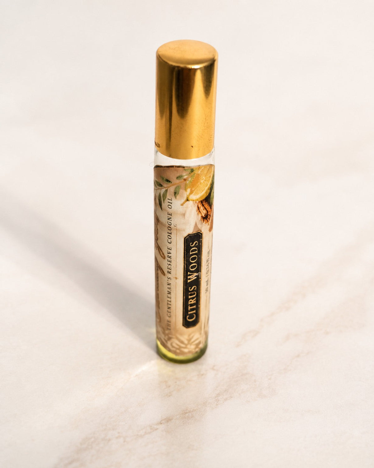 Citrus Woods 10 mL cologne oil roller standing upright from The Gentleman’s Reserve by Essentially Yours