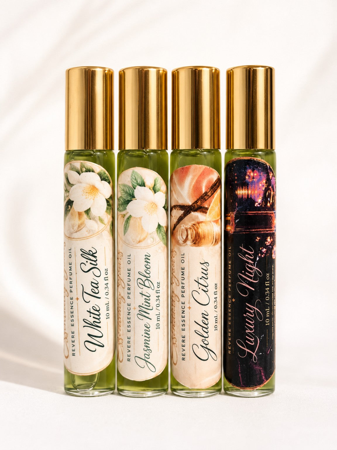 Revere Essence Perfume Oil Collection by Essentially Yours featuring White Tea Silk, Jasmine Mint Bloom, Golden Citrus, and Luxury Night